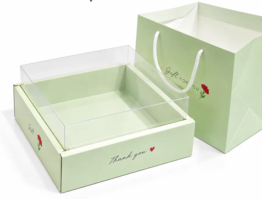 Bộ quà 20/11 số lượng lớn gồm hộp đế giấy nắp mica và túi giấy xanh mint